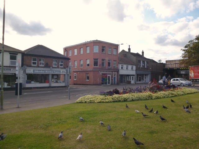 Aldershot High Street showing shops and the former Boulters Hotel building